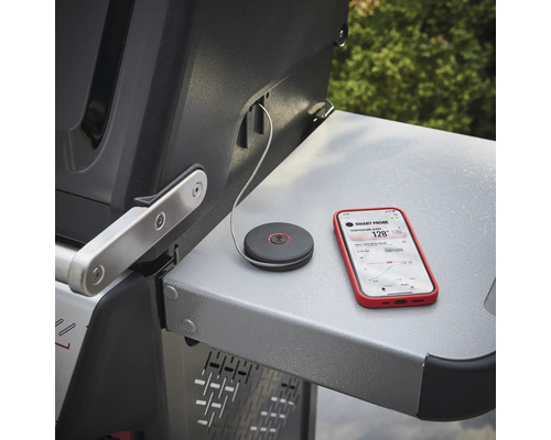 Sonde de température Smart Probe avec smartphone sur une table de grill
