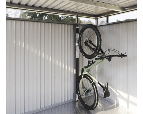 Vélo sur un support à vélos dans un abri à vélos