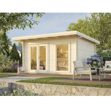 Jardin avec abri de jardin en bois, coin salon et terrasse en pierre