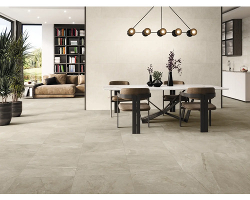 Salon lumineux avec table à manger et carrelage.