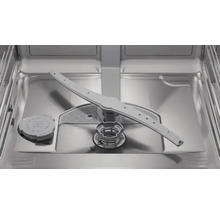 Intérieur d'un lave-vaisselle avec bras d'aspersion et filtre