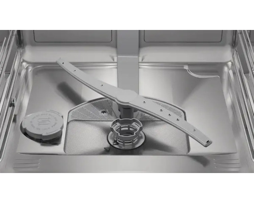 Intérieur d'un lave-vaisselle avec bras d'aspersion et filtre