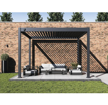 Pergola avec mobilier de jardin sur terrasse devant un mur en briques