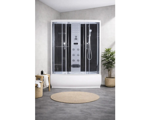 Cabine de douche complète avec panneau de commande, pomme de douche et portes coulissantes dans la salle de bain