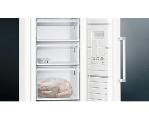 Congélateur ouvert avec des aliments dans les tiroirs