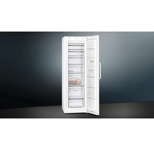 Congélateur blanc ouvert avec plusieurs compartiments de congélation