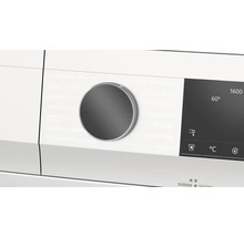 Nahaufnahme des Bedienfelds einer Waschmaschine mit Programmwähler und Display