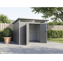 Abri de jardin en métal avec portes doubles ouvertes dans le jardin