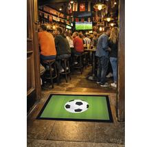 Paillasson avec motif de ballon de football devant un bar