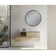 Salle de bains moderne avec meuble sous-lavabo, miroir rond et paroi de verre décorative