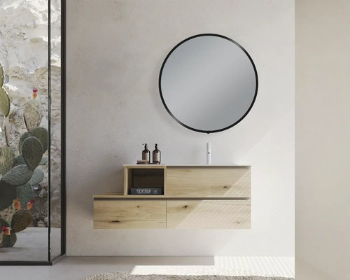 Salle de bains moderne avec meuble sous-lavabo, miroir rond et paroi de verre décorative