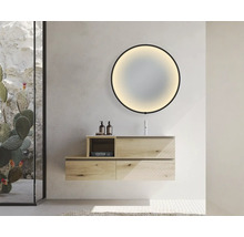 Salle de bains moderne avec meuble-lavabo, miroir rond avec rétroéclairage et paroi de douche en verre.