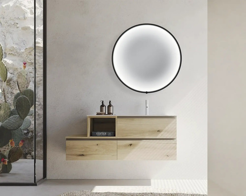 Salle de bains avec meuble sous-vasque, miroir rond et articles de décoration