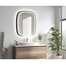 Salle de bain avec meuble-lavabo, miroir avec éclairage et plante d'intérieur