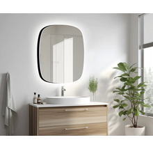 Salle de bains avec meuble-lavabo, miroir avec éclairage et plante d'intérieur.