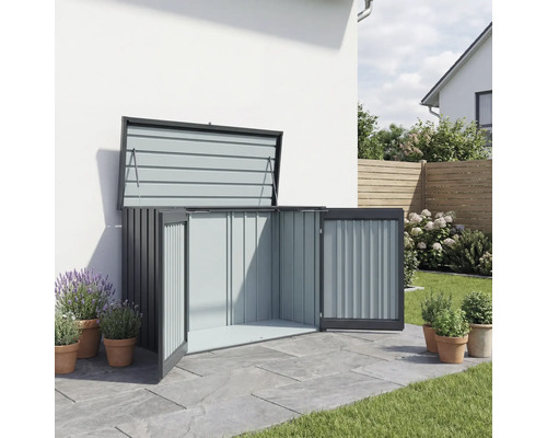 Coffre de rangement ouvert pour outils de jardin dans le jardin