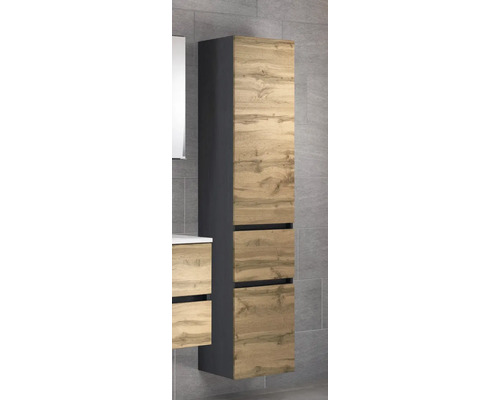 Colonne de salle de bains avec façades aspect chêne et corps anthracite, montage mural devant un mur de carrelage gris.