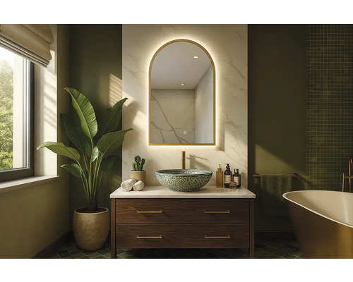 Salle de bains avec meuble-lavabo, miroir et plante pour une ambiance claire et spacieuse.
