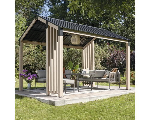 Pavillon indépendant avec mobilier de jardin sur une terrasse dans le jardin.