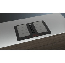 Siemens Kochfeld mit integriertem Dunstabzug in einer modernen Küche.