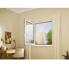 Pièce lumineuse avec fenêtre ouverte, bureau et décorations.