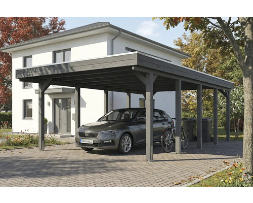 Carport en bois avec voiture et vélo devant une maison