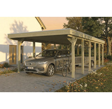Carport en bois avec voiture, vélo et remorque sur un sol pavé