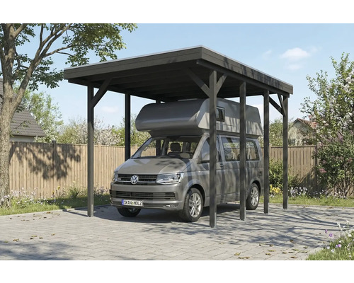 Carport en bois avec camping-car gris sur sol pavé