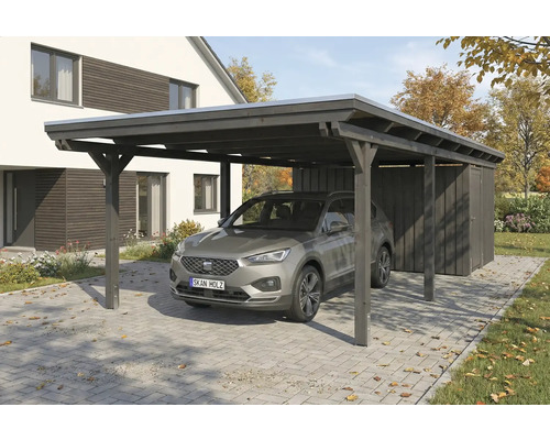 Voiture sous une clôture en bois sombre avec remise à outils