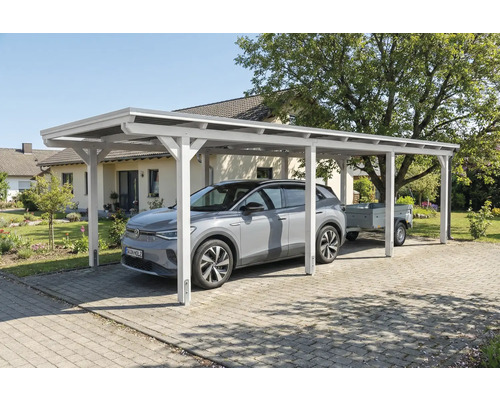 Abri de voiture en bois blanc avec voiture et remorque