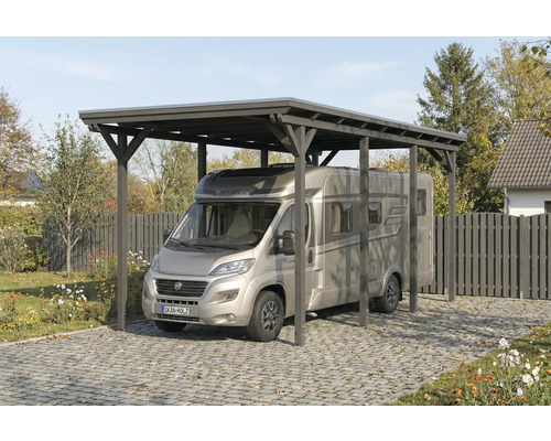 Carport en bois avec camping-car sur sol pavé