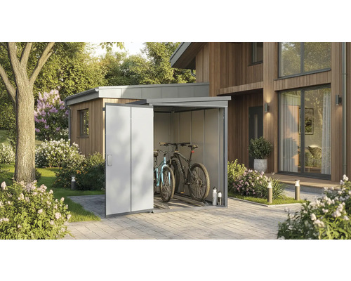 Garage à vélos en métal avec deux vélos dans le jardin