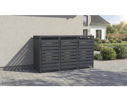 Cache-poubelle triple en métal anthracite sur une surface pavée devant le mur clair d une maison.