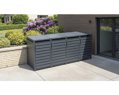 Cache-poubelle moderne pour quatre bacs en métal anthracite avec portes à lattes sur une terrasse pavée à côté d'un jardin.