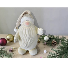 Dekorative Weihnachtsmann-Figur aus weichem Material mit langem Bart und Zipfelmütze in einer weihnachtlichen Umgebung.