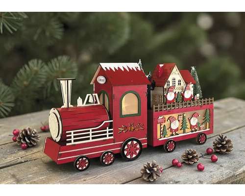 Dekorativer roter Weihnachtszug aus Holz mit Lokomotive und Waggon, verziert mit Weihnachtsmannfiguren auf einer Holzoberfläche.