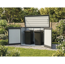 Abri pour poubelles en métal ouvert contenant deux poubelles noires sur une surface pavée dans un jardin.