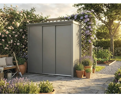 Armoire de jardin moderne en métal avec portes coulissantes sur une terrasse en pierre dans un jardin lumineux et organisé avec fleurs et plantes.