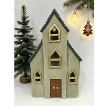 Dekorative Weihnachts-Kirche aus Keramik mit goldfarbenen Fenstern und grünem Dach.