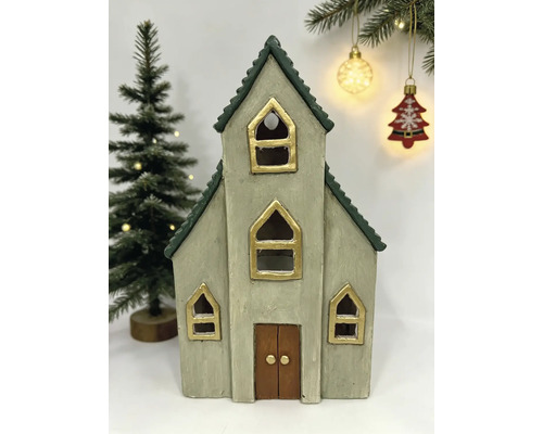 Dekorative Weihnachts-Kirche aus Keramik mit goldfarbenen Fenstern und grünem Dach.