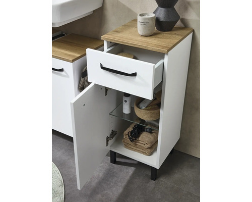 Meuble bas de salle de bain blanc avec plateau aspect bois, un tiroir et une porte avec poignées noires.
