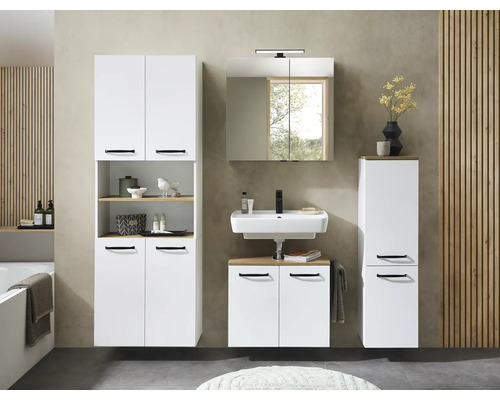 Ensemble de meubles de salle de bain blanc avec poignées noires, incluant sous-vasque, vasque en céramique, armoire de toilette et colonnes.