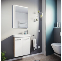 Salle de bains moderne avec meuble sous-vasque blanc, lavabo en céramique, miroir LED et toilette suspendue. Ambiance lumineuse.