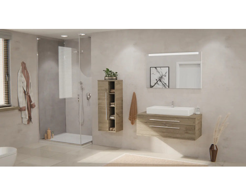 Salle de bains moderne avec meuble sous-vasque en bois, vasque à poser blanche, miroir éclairé, armoire haute et douche en verre.