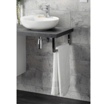 Salle de bains moderne avec vasque à poser ronde sur un plan de toilette sombre aspect pierre, robinetterie chromée et porte-serviette.