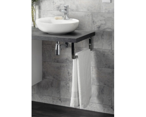 Salle de bains moderne avec vasque à poser ronde sur un plan de toilette sombre aspect pierre, robinetterie chromée et porte-serviette.