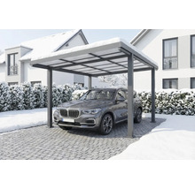 Carport moderne en aluminium avec un SUV en dessous dans un paysage d'hiver enneigé.