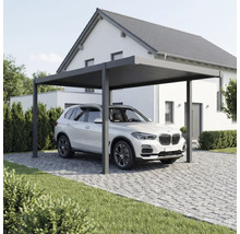 Moderner Metall-Carport in Anthrazit mit Flachdach, unter dem ein SUV auf einer gepflasterten Einfahrt vor einem Wohnhaus parkt.