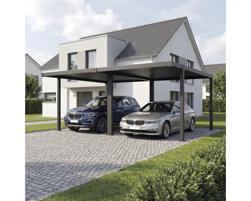 Abri de voiture double moderne en métal avec toit plat devant une maison, allée pavée avec deux voitures.