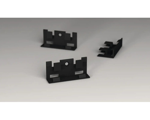 Clips de fixation noirs en plastique avec des trous pour les vis.